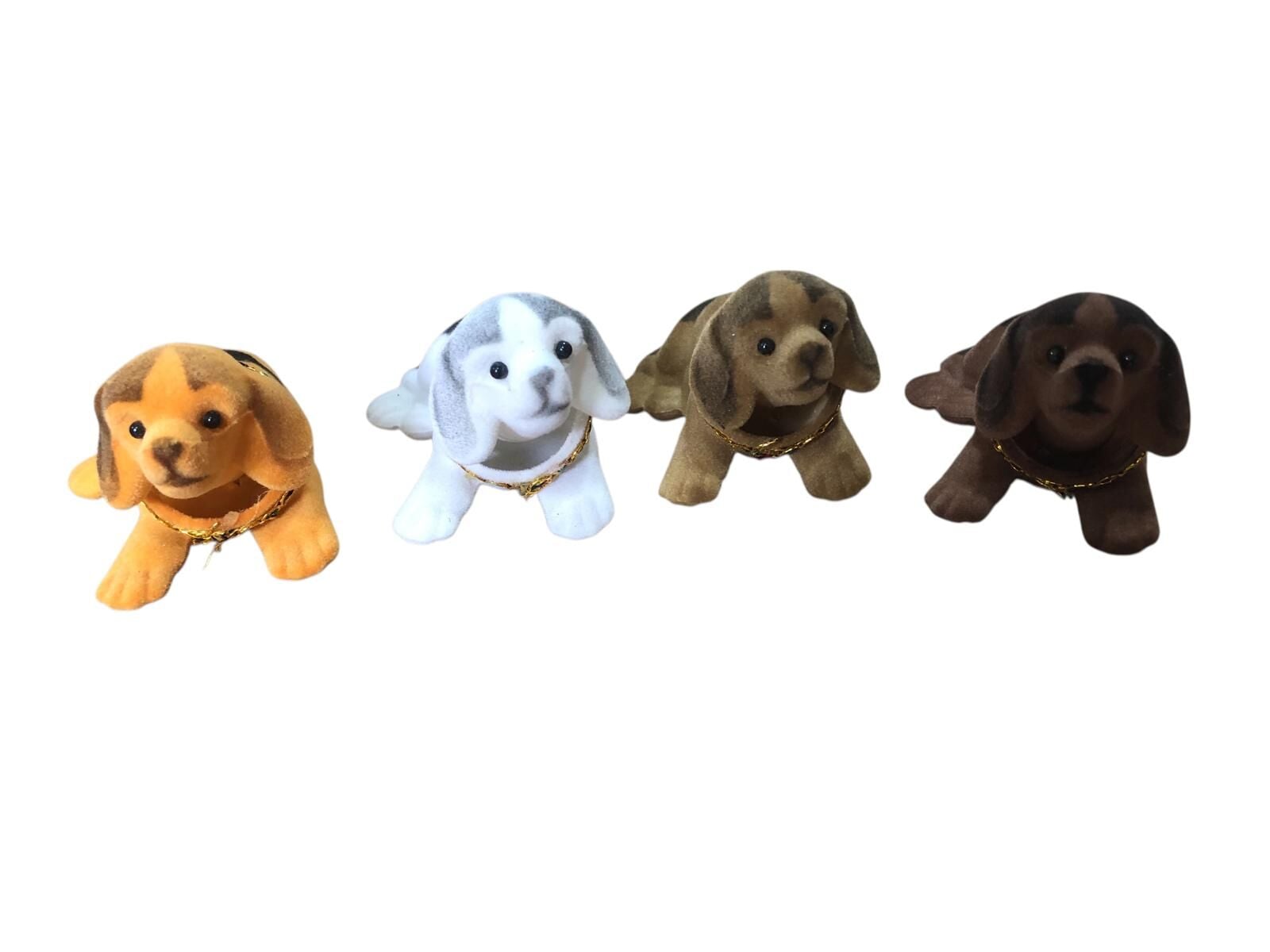 Mini Kafasını Sallayan Köpek